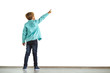 © Artem - The little boy gesturing on the white wall background