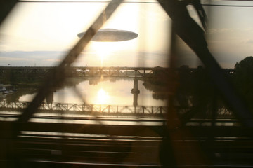 Wall Mural - ufo see from a running car on a bridge, photo manipulation