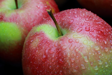 wet apples on a black background