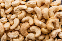 Cashew Nuts On A Dark Stone Background