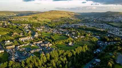 Wall Mural - aerial hyperlapse of the welsh town of ebbw vale near sunset
