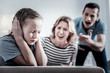 © zinkevych - Accuses. Angry nervous parents shouting on a child while being in a room
