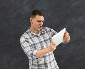 Wall Mural - Handsome man playing on his gaming console