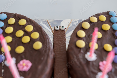 Kinder Schoko Kuchen Mit Smarties Und Kerzen In Schmetterling Form Buy This Stock Photo And Explore Similar Images At Adobe Stock Adobe Stock