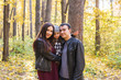 © satura_ - Fall, nature and family concept - Portrait of happy family over autumn park background