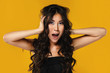 © blackday - Asian woman with a beautiful curly hair and make-up on yellow background