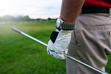 Wall Mural - The golfer holding a golf club to hit a golf ball