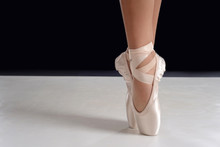 Closeup Of Ballerina Feet On Pointe In Pointe Shoes
