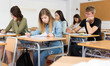© JackF - Girl is writing test and answer about task