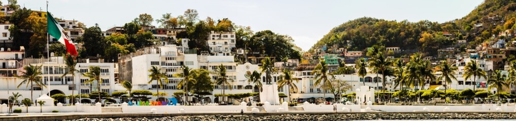 The port of Manzanillo, Mexico. Large panoramic view of the downtown area, shot from the harbor.