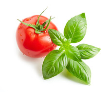 Fresh Red Wet Tomato And Basil Leaves Isolated On White Background