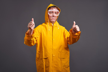 Man in yellow raincoat