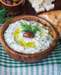 Poster - Tzatziki sauce in wooden bowl