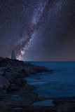 Fototapeta Na sufit - Vibrant Milky Way composite image over landscape of Rocky cliff landscape over ocean
