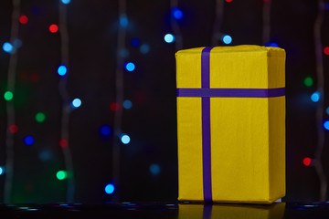 gorgeous yellow design box for gifts on colorful background