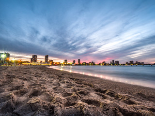 Wall Mural - beautiful sunset photograph of the beach and sand along the shoreline of lake michigan at north aven