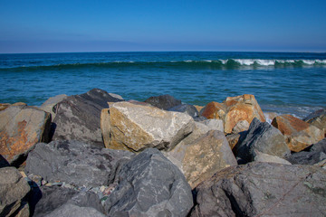 waves crash on rocky beach