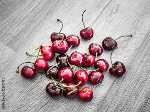 Fotografia, Obraz Close up photo of mouth watering pile of ripe cherries with stems with the fruit