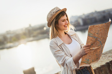 happy blond female traveling and sightseeing