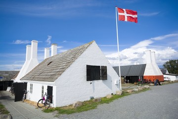 Wall Mural - Old traditional smokehouses with characteristic chimneys in Hasle, Bornholm, Denmark. This is the place, where you can taste the most popular dish on the island - Sol over Gudhjem