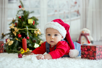 Canvas Print - Portrait of newborn baby in Santa clothes and christmas hat