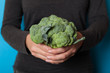 Tree broccoli in hands, beauty antioxidant vegetarian food.