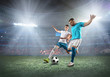 © Andrii IURLOV - Soccer player on a football field in dynamic action at summer da