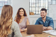 © contrastwerkstatt - Three young people in a meeting together