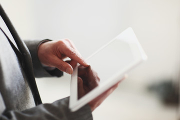 Wall Mural - close up.blurred image businessman presses on the screen of a digital tablet.photo with copy space