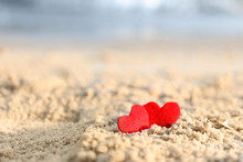 Small Red Hearts On Beach Sand