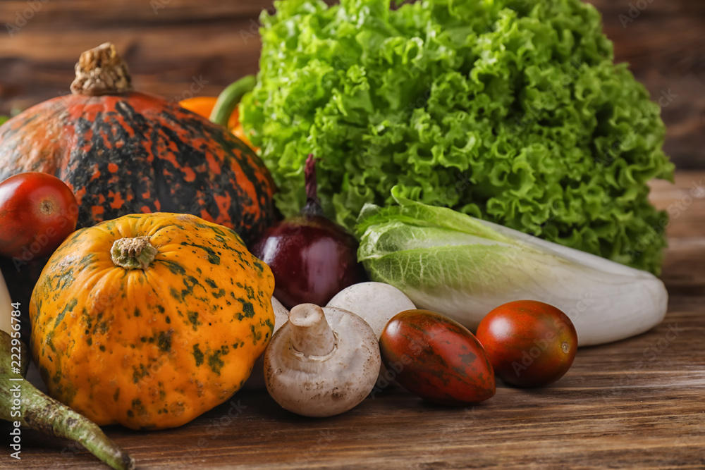 Different fresh vegetables on wooden table