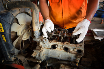 Wall Mural - Workers are gathering tools in the factory, which is at the heart of the tractor.