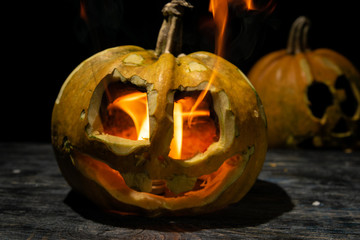 pumpkin on a halloween. on a dark background with fire