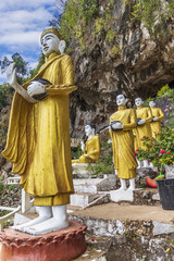 Wall Mural - Buddha Statues at the entrance to Yathaypyan Cave, Hpa An, Myanamar