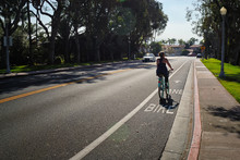 Woman riding her cruiser down the bike lane