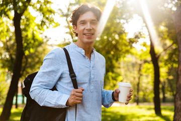 Wall Mural - Attractive young casual man drinking coffee