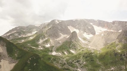 Wall Mural - mountain and snowy peaks aerial landscape from drone. caucasus mountains peak