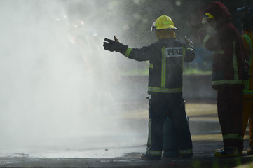  firefighters training with fire hose