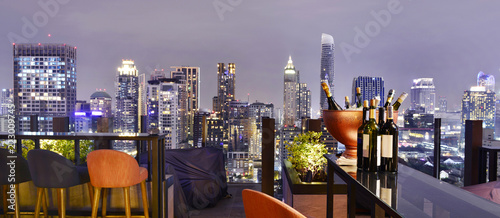 Cuadros en Lienzo Bangkok city view point from rooftop bar, overlooking a magnificent cityscape bl
