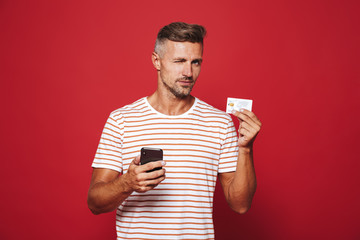 Poster - Portrait of a man standing over red background