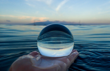 Blue Ripples on Ocean Surface Captured in Glass Ball