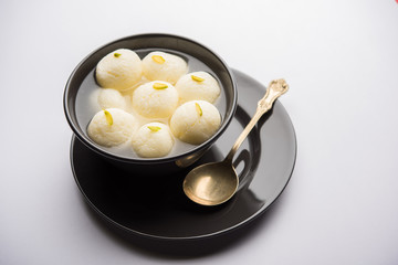 Indian Rasgulla or Rosogulla dessert/sweet served in a bowl. selective focus