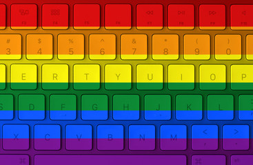 LGBT flag and computer keyboard in the background. Gay flag