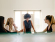© Jacob Lund - Group of women having a meeting in boardroom