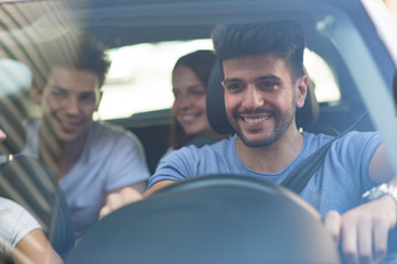 Group of friends on a car