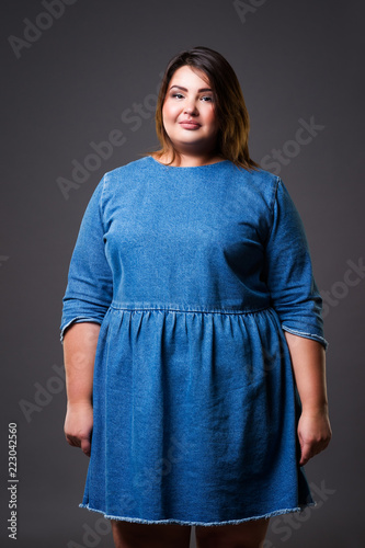 Plus Size Model In Denim Dress Fat Woman On Gray Background Overweight Female Body Buy This Stock Photo And Explore Similar Images At Adobe Stock Adobe Stock