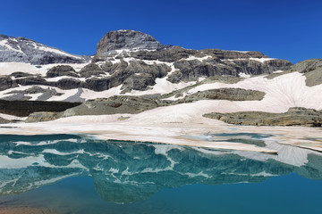 Wall Mural - Monte Perdido Peak and Marbore cylinder from Marbore Iced lake in Ordesa national Park, Spain