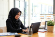 © Prathankarnpap - Islam woman working with laptop computer, Businesswoman working in office.