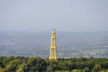 Yellow tower with beautiful forest landscape aerial view in Hungary