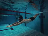 Fototapeta Tęcza - Swimmer in the Pool Underwater